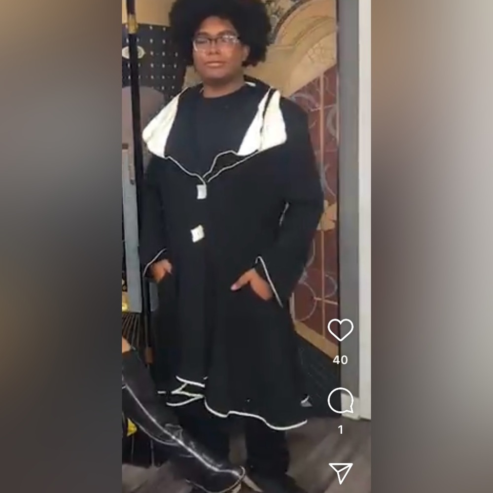 Vintage, black and white coat that drapes at the bottom